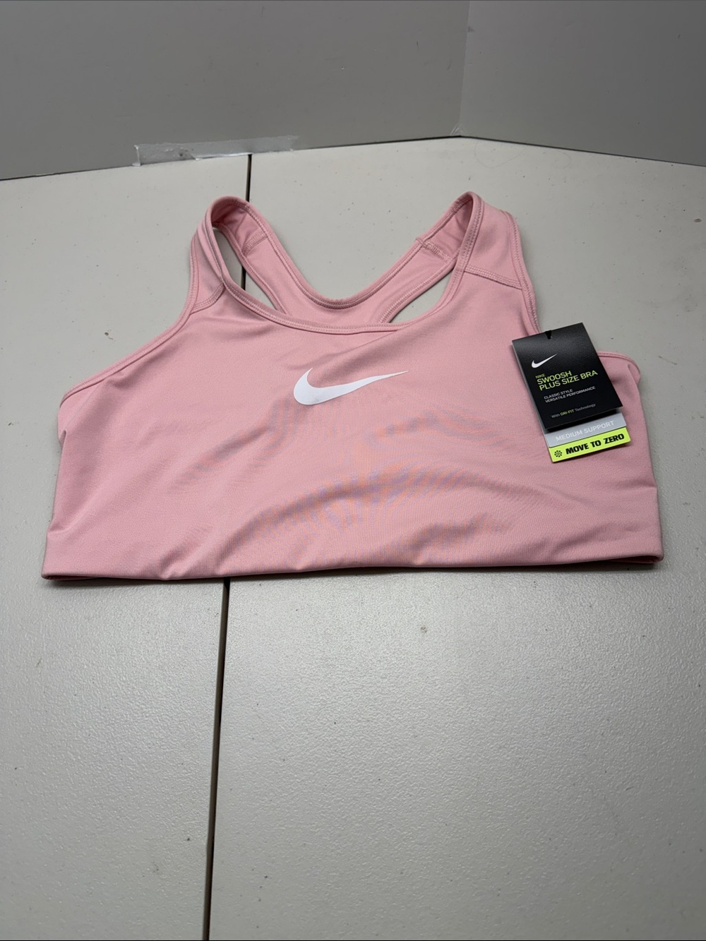 Nike Light Pink Racerback Sports Bra with White Swoosh